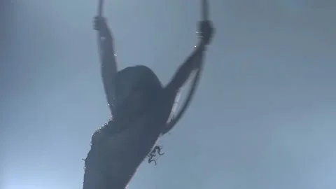 Young girl performs the acrobatic elements in the air ring. Slow motion. Closeup Stock Footage 110652987