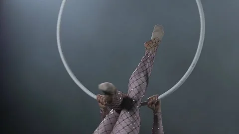 Young girl performs the acrobatic elements in the air ring. Slow motion. Closeup Stock Footage 110654168