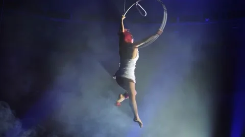 Young girl performs the acrobatic elements in the air ring Stock Footage 149176356