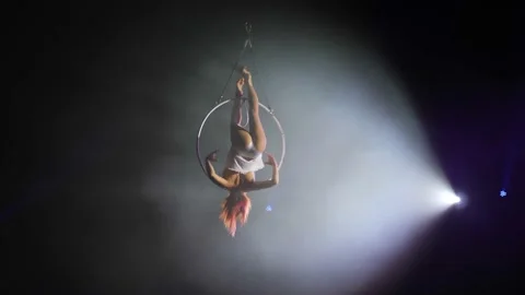 Young girl performs the acrobatic elements in the air ring Stock Footage 149176446