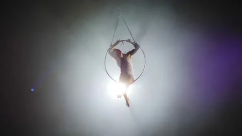 Young girl performs the acrobatic elements in the air ring Stock Footage 149176551