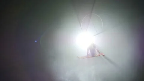 Young girl performs the acrobatic elements in the air ring Stock Footage 149176871
