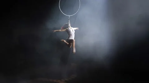 Young girl performs the acrobatic elements in the air ring Stock Footage 149177016