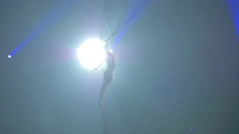 Young girl performs the acrobatic elements in the air ring Stock Footage 149183036