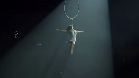 Young girl performs the acrobatic elements in the air ring Stock Footage 149183222