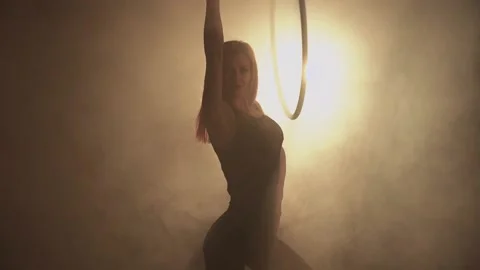 Young girl performs the acrobatic elements in the air ring Stock Footage 233455948