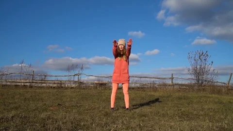 Young girl performs a basic set of exercises for warming up the muscles Stock Footage 120698698