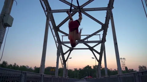 Young girl performs gymnastic elements on air loops. circus artist Stock Footage 155311984