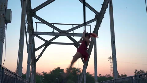 Young girl performs gymnastic elements on air loops. circus artist Stock Footage 155312167