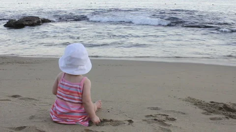 Young girl playing the beach Stock Footage 1066796