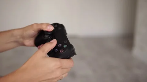 Young girl playing console. Close-up. Stock Footage 112812892