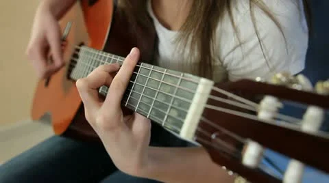 Young Girl Playing Guitar Stock Footage