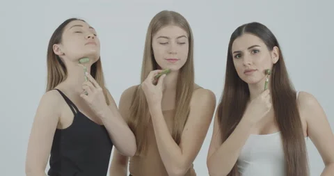 Young girl posing at camera massaging owl face to advertise beauty products 스톡 동영상 147614682