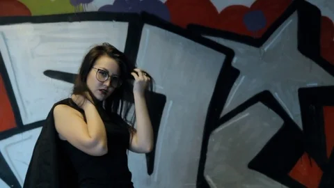 Young girl posing in the underpass. Video stock 85074575