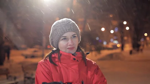 Young girl posing on a winter evening on camera. It is cold, winter Stock Footage 101717439
