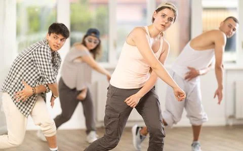 Young girl practicing basic hip hop steps in training hall 스톡 사진