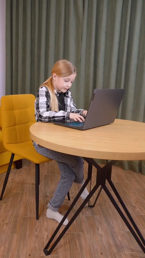 Young girl programming using laptop at home Stock-Footage 315881275
