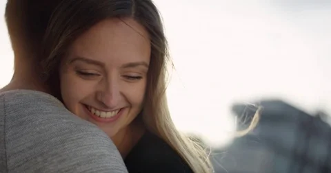 Young girl is really happy while her boyfriend is holding her in his arms Stock Footage 79815023