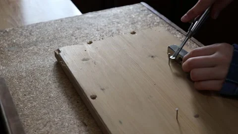 Young girl removing nails using pilers. Stock Footage 140723732