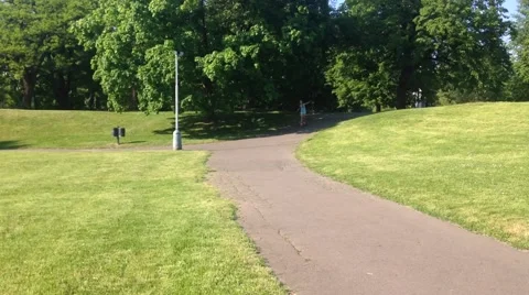 Young Girl is Rolling Down a Hill on the Longboard Video stock 60631153