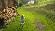 Young Girl Running By Farm Barn Slow Motion Stock Footage
