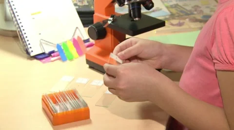 A young girl running with a microscope. Stock Footage 68392784