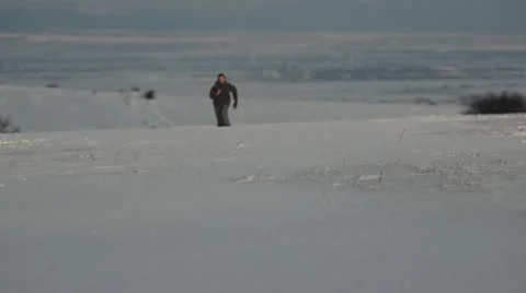 Young girl running on snow Stock Footage 20486853