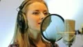 The young girl sings in the profi audio studio HD Footage