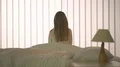 The young girl sitting on the bed 4k or 4k+ Resolution