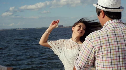 Young girl smiling, dancing on the beach Stock Footage 60843653