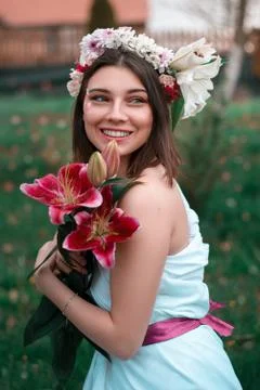 A young girl smiling in the garden in spring Stock Photos
