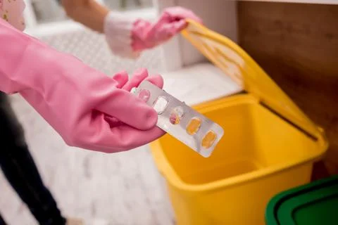 Young girl sorting garbage at the kitchen. Concept of recycling. Zero waste Stock Photos