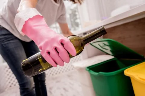 Young girl sorting garbage at the kitchen. Concept of recycling. Zero waste Stock Photos
