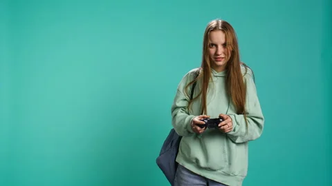 Young girl spamming controller buttons, disappointed after game over Stock Footage 276510295
