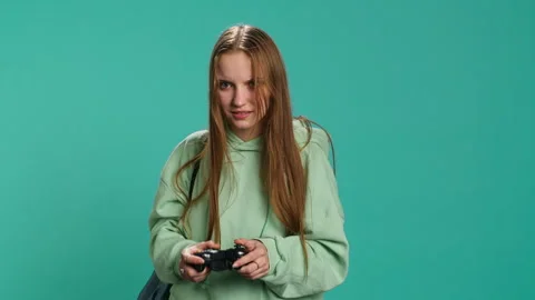 Young girl spamming controller buttons, disappointed after game over Stock Footage 276510477