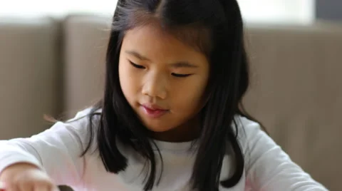 Young girl stacking blocks Stock Footage 55647795