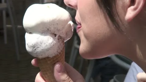 Young girl sucking ice cream Stock Footage