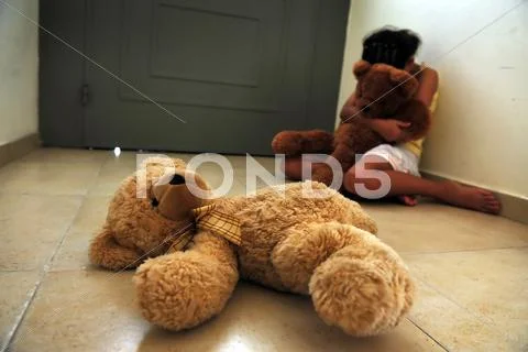 Young girl suffers from domestic violence Stock Photos