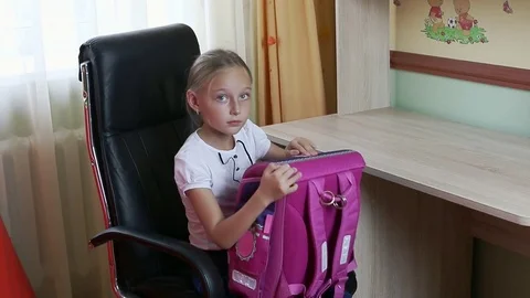 Young girl take backpack, open it and take out papers notebooks pen pencil. Put Video stock 79004334