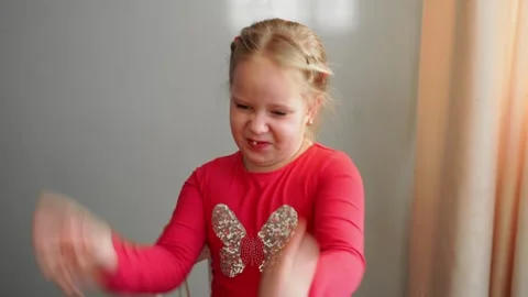 Young girl talking and gesturing expressively with her hands, making a decision Stock Footage 304459745