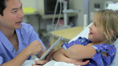 Young Girl Talking To Male Nurse In Intensive Care Unit Stock Footage