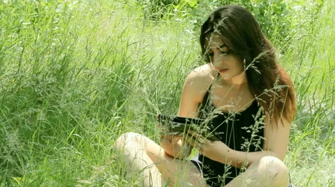 Young Girl Tourist using Map app on Smartphone in the Forest Stock Footage 63565260