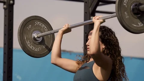 Young girl training weights Stock Footage 100883207