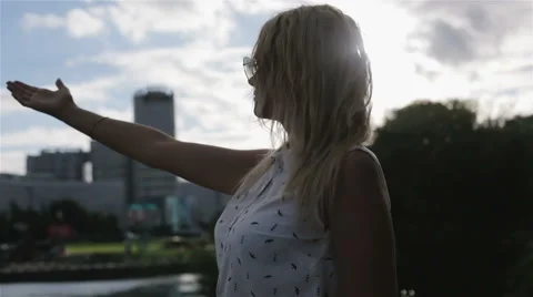 A young girl trying to touch wind Stock Footage 66441590