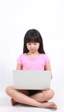 Young girl typing the computer Stock Photos