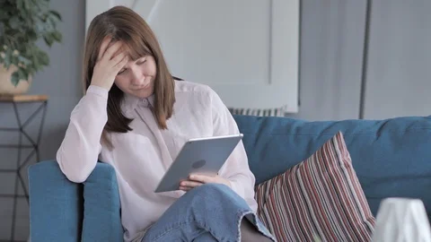 Young Girl Upset by Failure while Using Tablet Stock Footage 98169701