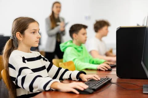 Young girl using computer during lesson 스톡 사진
