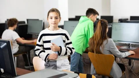 Young girl using computer during lesson 스톡 사진