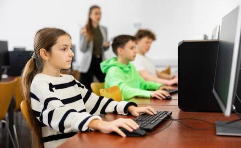 Young girl using computer during lesson 스톡 사진
