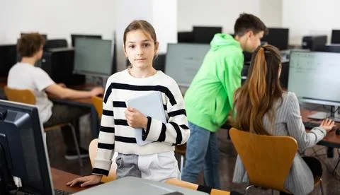 Young girl using computer during lesson 스톡 사진